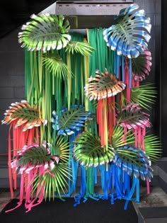 an art installation made out of plastic straws and palm leaves