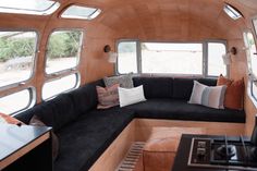 the interior of an rv with lots of windows