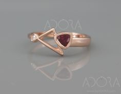 ✿ THE JEWEL A handmade solid 14k rose gold statement ring set with a trillion cut Ruby and a diamond. A remarkable, and unique abstract design of a Trillion Cut natural Ruby ring, To make you look and feel special. A dainty ring, yet no one can ignore. If you are looking for something exceptional, this ring is for you! ✿ THE LITTLE DETAILS... Your ring will be handmade form 14k (or 18k) rose gold. In the wider part the ring's width is 3mm and in the thinner part the ring's width is 1.2mm The center stone is a 0.25ct/4mm Trillion Cut Ruby complemented by a 2mm brilliant cut diamond. Diamond clarity SI1-VS, Color D-F(collection). I use only certified CONFLICT-FREE diamonds in my designs. ✿ HOW FAST CAN I GET IT? It will take me about 7 days to craft your ring and set all the gems in place. T Trillion Cut Rose Gold Jewelry Gift, Trillion Cut Ethical Diamond Ring In Rose Gold, Rose Gold Ring Set, Natural Ruby Ring, Zierlicher Ring, Gold Statement Ring, 14k Rose Gold Ring, Gold Ring Sets, Ruby Ring