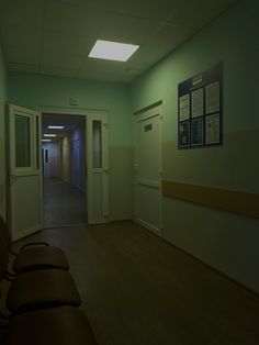 an empty hospital hallway with no one in the room or waiting for someone to come home