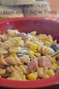 a red bowl filled with ham and cheese pasta