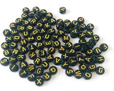 black and yellow letters are scattered on top of each other