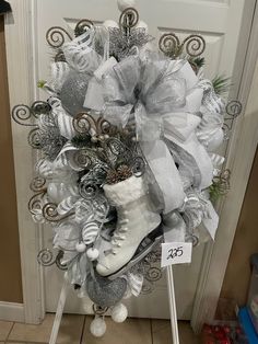 a christmas wreath with ice skates and decorations