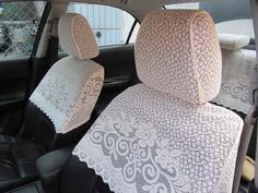 the interior of a car with white lace on it