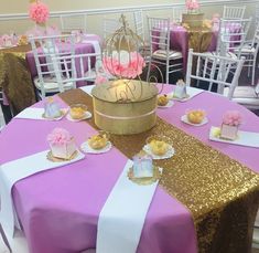 the table is set up for a princess party with pink, gold and white decorations