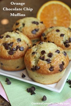 orange chocolate chip muffins on a white plate