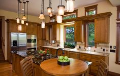 a kitchen with wooden cabinets and an island