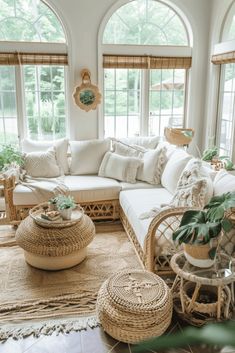 a living room with wicker furniture and large windows in the corner, all white