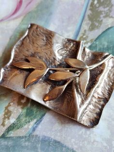 This is a vintage, sterling silver with a gold wash, Golden Wreath Society of Major Donors, Hadassah, 1999 brooch (you can use it as a pendant as it has a hanging loop as well). It has a branch with leaves on it. This is marked and has tested positive for sterling silver. The piece measures: a hair over 2.25 x a bit over 1.5 inches. Don't forget to stop in at my other Etsy shop... http://www.etsy.com/shop/xtdesigns. Follow me on Twitter at... MyYiayiaHadThat@MyYiayiaHadThat. If you have a wish l Handmade Artistic Gold Brooch, Antique Gold Sterling Silver Brooch, Antique Gold Sterling Silver Brooches, Artisan Gold Brooches For Gifts, Gold Sterling Silver Brooch For Anniversary, Gold Sterling Silver Brooches For Anniversary, Gold Sterling Silver Brooches As Gift, Gold Sterling Silver Brooches For Gift, Golden Wreath