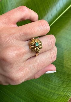 18k Vintage Natural Emerald Large Flower Ring          Description:     18k Vintage Natural Emerald Large Flower Ring Size: 7.25 ( Can be resized) flower measures 13.3mm in length Natural Emerald measures: 3.9mm          Details:               Material: Please refer to product specifics for details          Design: Unique and elegant          Style: Versatile, perfect for any occasion          Perfect for: Everyday wear, special occasions, gifts               Why You'll Love It:               Timeless Design: Adds a touch of elegance and sophistication to your look.          High-Quality Craftsmanship: Ensures durability and timeless appeal.          Versatile Style: Perfect for both everyday wear and special occasions, making it a versatile addition to your jewelry collection.          Su Victorian Emerald Ring In Yellow Gold Stamped 14k, Victorian Emerald Ring In 14k Yellow Gold, Gold Flower Ring With Emerald, Gold Flower Ring With May Birthstone, Anniversary Yellow Gold Flower Ring With May Birthstone, Vintage Yellow Gold Flower Ring With Gemstone, Vintage Flower Gemstone Jewelry, Vintage Flower-shaped Gemstone Jewelry, Gold Flower Ring For Anniversary - May Birthstone