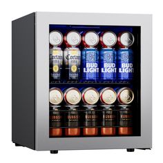 a mini fridge with six cans of beer in it