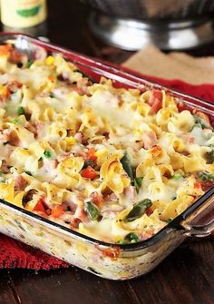 a casserole dish filled with pasta and vegetables