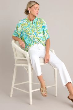 Get transported to paradise with our Seaside Escape Teal Tropical Print Button Front Top! Made with soft, breathable fabric, this top features a playful tropical print that will make you feel like you're on vacation all day long. With a comfortable and stylish button front design, you'll be ready for any adventure. This top features a collared neckline, a full button front, a functional breast pocket, a vibrant print, and a split high-low hemline. Tropical Print Top, Sorority Rush Dresses, Cardigan Crop Top, Cardigan Crop, Button Front Top, Friend Outfits, Long Crop Top, Little White Dresses, Floral Print Tops