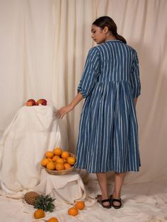 Blue stripes and check gathered dress 100% Cotton Fabric Hand block printed striped cotton fabric Waist gathers, button-down calf-length dress Band neck, pockets Measurements: S - Shoulder-14.5”, Bust-36”, Waist-32” M - Shoulder-15”, Bust-38”, Waist-34” L - Shoulder-15”, Bust-40”, Waist-36” XL - Shoulder-15.5”, Bust-42”, Waist-38” XXL - Shoulder-16”, Bust-44”, Waist-40” Length - 46" Wash Care Instructions: Dry Clean Only The product will be shipped within 20-25 days of the order placed Sunday Dress, Calf Length Dress, Gathered Dress, Sea Blue, Dress 100, Shop Dresses, Xl Dress, Blue Sea, Dresses For Women