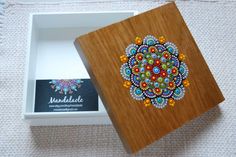 a wooden box with beaded designs on it