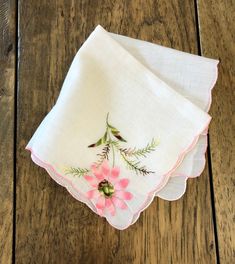 "This handkerchief features lovely raised floral detail with pretty colors. It is in very good vintage condition with one flower petal end fraying a bit...price reflects this. Use it for a personal accessory, at your celebration, for crafts or hang it as it is that pretty. I use handkerchiefs as doilies too. Very charming... Approximate overall measurements: 10.5\" square Please zoom on photos for a closer view. Check out our other vintage hankies: https://www.etsy.com/shop/TwoBeContinued?ref=se Vintage Pink Handkerchiefs For Wedding, Vintage Pink Wedding Handkerchiefs, Vintage Pink Flower-shaped Handkerchief, Pink Vintage Flower-shaped Handkerchief, Vintage Pink Floral Embroidered Handkerchiefs, Pink Vintage Handkerchiefs With Floral Embroidery, Pink Flower Shaped Handkerchiefs For Gifts, Flower Shaped Pink Handkerchiefs For Gifts, Pink Flower-shaped Handkerchief For Gift