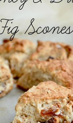 some biscuits are sitting on a table with the words honey and biscuit fig scones