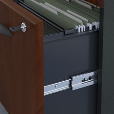 an open file cabinet with files and folders in it's drawer area,