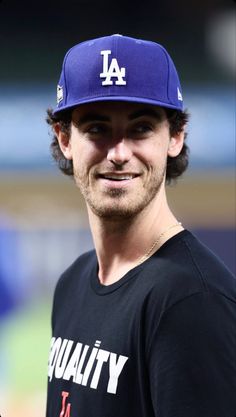 a man wearing a los angeles dodgers hat