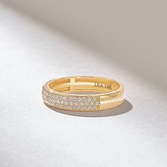 The Micro Pave Diamond Wedding Band is a stunning and elegant marriage ring crafted from 14k solid gold. This 3.80MM-wide ring features a minimalist design with a row of tiny diamonds that are meticulously set in a micro-pave setting. The total carat weight of the diamonds on the band is 0.3CT, adding a touch of sparkle and luxury to the ring. Features * Made to Order. * Gold KT: 10K, 14K, 18K * Custom Gold Color: Rose Gold, Yellow Gold, White Gold * Width of Band: 3.82MM * Thickness of Band: 1.32MM * Diamond Color-Clarity: D-E-F color VVS Clarity * Total CTW: 0.30ctw * Ready to Ship in 5-7 Business Days ✓ We care about the environment,the jewelry we cast is made with recycled gold. We source exclusively post-consumer material that is refined back to their pure elements to ensure that the Stunning Rings, Pave Diamond Wedding Bands, Micro Pave Ring, Marriage Ring, Ring Inspo, Classic Wedding Band, Matching Ring, Wide Ring, Rings Jewelry Fashion