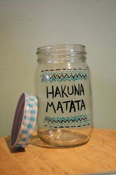 a glass jar with the words hakuna matata on it