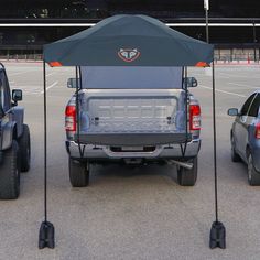 the back end of a pick up truck with an umbrella over it's bed