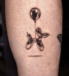 a tattoo on the leg of a person with an object in it's center