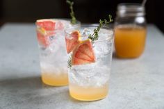 two glasses filled with lemonade and grapefruit