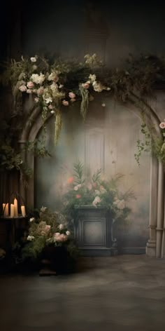 an arch with flowers and candles in it