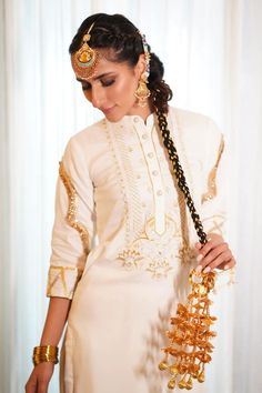 White kurta with gold, silver zari thread and bead embroidery in floral pattern on yoke. Paired with gota border embroidered salwar and potli. - Aza Fashions Eid Saree With Gold Embroidery, Chanderi Traditional Wear With Gold Embroidery For Festivals, Festival Sharara With Gold Embroidery And Straight Kurta, Festival Chanderi Traditional Wear With Gold Embroidery, Traditional Gold Sharara With Gold Embroidery, Traditional Chanderi Salwar Kameez With Gold Embroidery, Elegant Kurta With Gold Embroidery For Festivals, Festive Kurta With Gold Embroidery For Festivals, Festive Kurta With Gold Embroidery