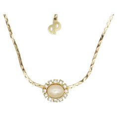 Christian Dior Vintage 1970s Oval White Pearl Sparkling Crystals Pendant Elegant Necklace, Gold Plated Very excellent condition. Marked 'Chr.Dior (C) '. 100% Genuine. Length: 36 cm. Extend chain: 6 cm. Pendant: 1.7*1.3 cm. Weight: 9 g. _ _ _ Great for everyday wear. Come with velvet pouch and beautiful package. Makes the perfect gift for Teens, Sisters, Friends, Girlfriends, Birthdays, Anniversaries, Mother’s Day, Valentine’s Day, Christmas and many more. With exquisite fine detail, these fashio Art Deco Pendant Necklace, Diamond Flower Pendant, Dior Vintage, Bracelet Love, Sea Pearls, Yellow Gold Pendants, Solitaire Pendant, Crystal Necklace Pendant, Silver Gifts