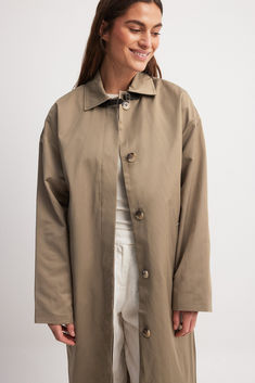 Trenchcoat Long Single-breasted Fall Raincoat, Fall Long Single-breasted Raincoat, Fall Long Single Breasted Raincoat, Classic Spring Raincoat With Button Closure, Khaki Long Coat With Hidden Button Closure, Long Raincoat With Button Closure For Work, Classic Long Single Breasted Raincoat, Classic Long Single-breasted Raincoat, Solid Gabardine Outerwear With Buttons