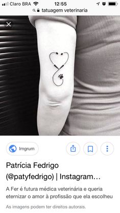 a person with a heart tattoo on their arm