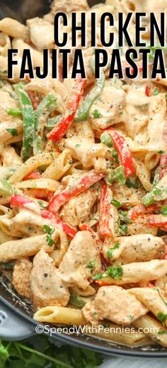 chicken fajita pasta in a skillet with red peppers and parsley on the side