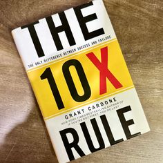 the 10x book is laying on top of a wooden table with it's cover pulled back