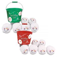 a group of white sheep sitting next to a green bucket with snowmen on it