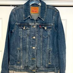 Size Medium, Slightly Distressed Wash Stretch Denim Jacket Not New But Never Worn. Levi's Medium Wash Button-up Denim Jacket, Levi's Medium Wash Denim Jacket, Levi's Light Wash Fitted Denim Jacket, Levis Denim Jacket, Levis Jacket, Levis Denim, Jean Jackets, Jean Coat, Stretch Denim