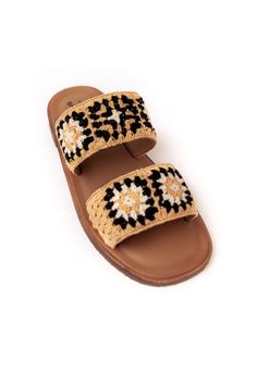 Hi. Hello. These sandals love long walks on the beach, summer shopping, + all things fun in the sun. The slip on style, backless design, + flat sole with open round toe is going to be your go to footwear from April to October. Thick toe straps adorned with a crocheted granny square inspired design in black + cream will match denim cutoffs, biker shorts, + flirty floral skirts. Effortless style is what I love + these slides are exactly that :) Lined footbed Made from Cotton + Rubber Vacation Slip-on Slippers With Round Toe, Slip-on Round Toe Sandals For Beach, Cushioned Slip-on Slingback Sandals For Beach, Summer Slip-on Slingback Sandals For Vacation, Casual Slingback Sandals With Woven Sole For Summer, Comfortable Slip-on Slippers For Vacation, Trendy Sandals With Woven Sole For Beach Season, Beach Slip-on Mules With Flat Heel, Trendy Sandals With Woven Sole For Summer