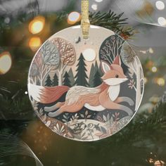 a glass ornament with an image of a fox on it