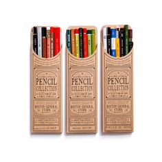 three pencils in a wooden box with different colors