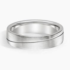 a white gold wedding ring on a white background