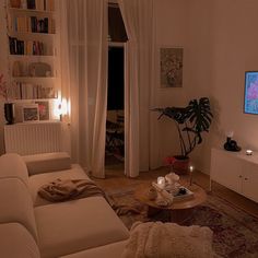 a living room filled with furniture and a flat screen tv