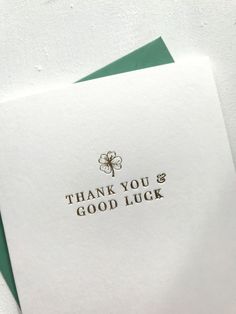 a thank you and good luck card on top of a green envelope with the words thank you and good luck