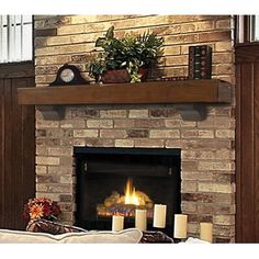 a living room with a fire place and candles