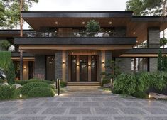 a large modern house with lots of windows and plants on the front porch, surrounded by greenery