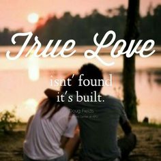 two people sitting next to each other on a beach with the words true love isn't found it's built