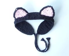 a crocheted hat with ears is shown