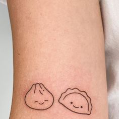 two small tattoos on the legs of people