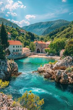 a river flowing through a lush green hillside