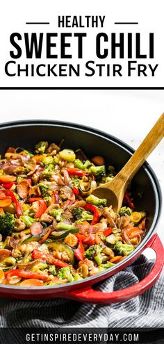 a skillet filled with chicken stir fry on top of a white and black towel